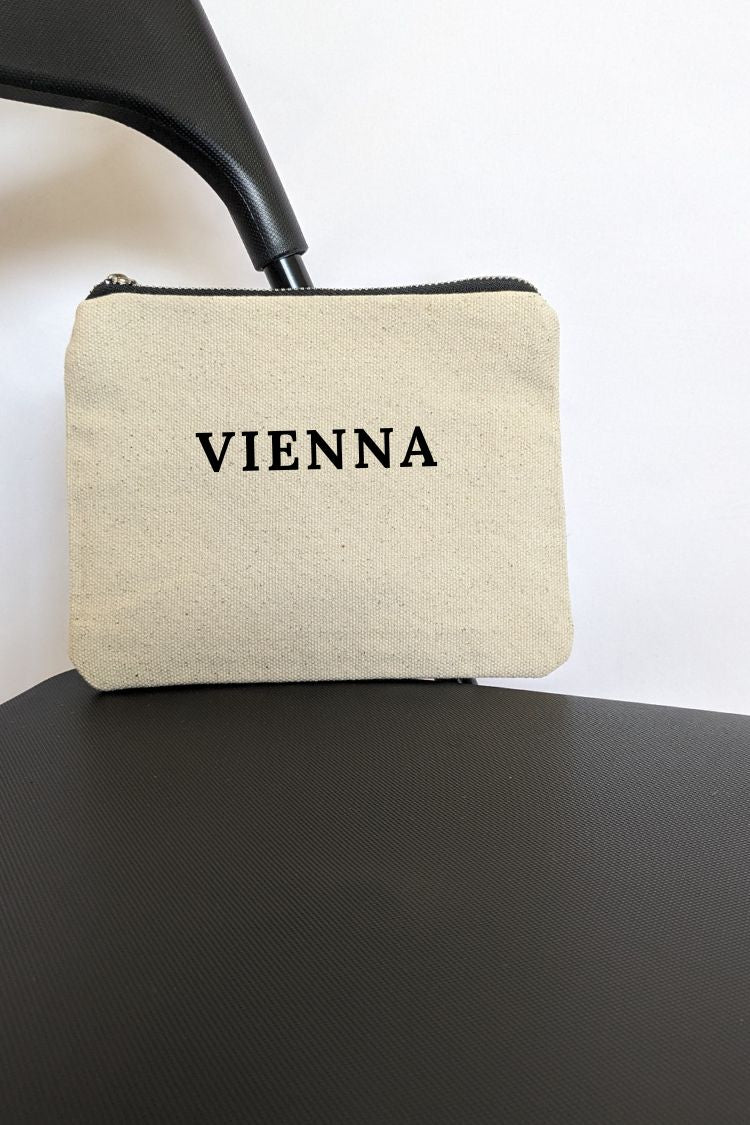 White cotton cosmetic bag with an inscription Vienna 031S01